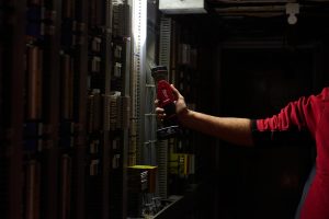 Milwaukee M12 LED torch in use in a dark workshop