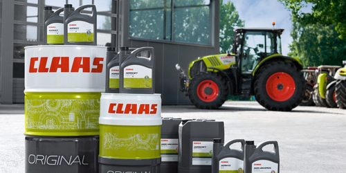 CLAAS oils and lubricants on display beside a CLAAS tractor